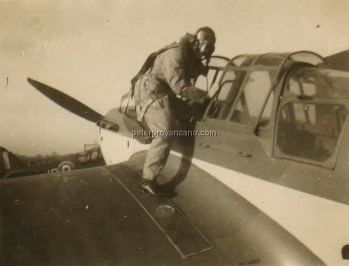 Peter Provenzano Photo Album Image_copy_054.jpg - "Dickie" Dickson climbing into the cockpit of a Miles Master Mark IA.  R.A.F. Station Tern Hill, fall of 1940.
(In Peter's notations he misidentified this pilot as a Leading Aircraftman (LAC), but there would be no reason a LAC (mechanic) would be in flight gear.)